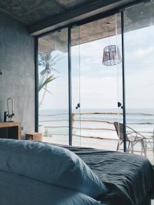 Postel nebo postele na pokoji v ubytování Morena Boutique Hotel Weligama