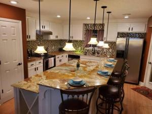 a kitchen with a large island with a counter top at 1Min to Percy Priest Lake 2 Masters Quiet Family Home in La Vergne