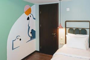 Letto o letti in una camera di Paliani Hotel