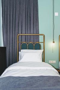 Letto o letti in una camera di Paliani Hotel