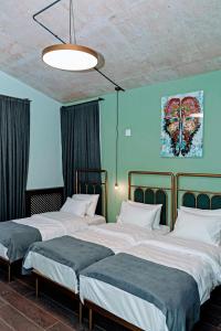 Letto o letti in una camera di Paliani Hotel