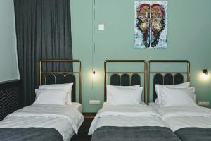 Letto o letti in una camera di Paliani Hotel