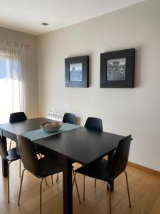 a dining room table with chairs and a bowl on it at Villa CL in Vila do Conde