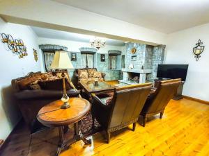 a living room with a couch and a table at Archontiko-Vytina in Vitina