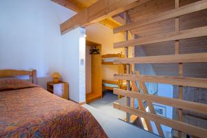 Postel nebo postele na pokoji v ubytování Hotel Les Lans