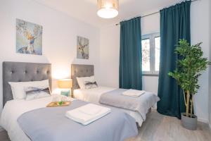 Ένα ή περισσότερα κρεβάτια σε δωμάτιο στο Happy Holiday Cascais