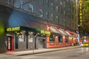 a building on a city street at night at Hotel Belmont Vancouver - MGallery Collection in Vancouver