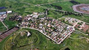 an aerial view of a city with lots of houses at קשת לכנרת-יחידת הקרקע in Keshet +11 photos