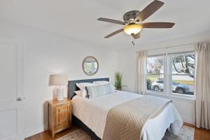 a bedroom with a bed and a ceiling fan at "Sweet Serenity" Stay 10 Minutes from Hershey home in Palmyra