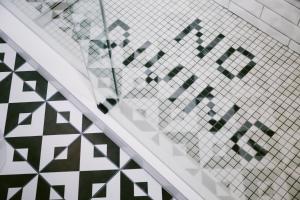 a stairwell with a patterned tile wall and a stair case at Hotel Belmont Vancouver - MGallery Collection in Vancouver +37 photos
