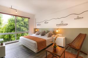 A bed or beds in a room at Rinconada Hotel Boutique