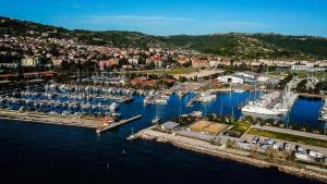 an aerial view of a harbor with boats in the water at MIRAMARE Romantic Experience with privat Jacuzzi - floating house in Portorož