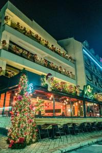 a christmas tree in front of a building at Mr.I Boutique Hotel & Bar in Ohrid