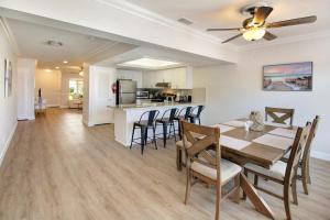 a dining room and kitchen with a table and chairs at The Waterman's Retreat- 3 bedroom waterfront unit in Fort Lauderdale