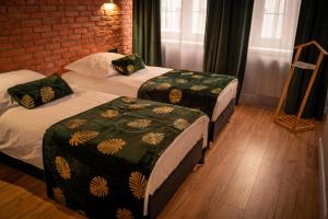 מיטה או מיטות בחדר ב-Apartament Wróblewski