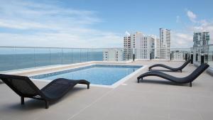 a swimming pool on the roof of a building at The Clover Suite in Cartagena de Indias