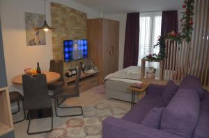 TV a/nebo společenská místnost v ubytování Apartman Enjoy N82 Milmari&spa