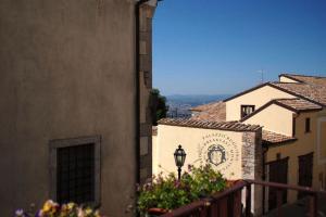 a view of a building with a street light and flowers at Palazzo Ruggiero in Montefusco