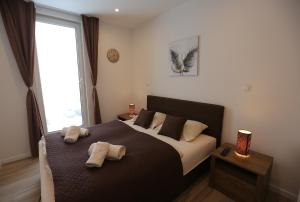 Ένα ή περισσότερα κρεβάτια σε δωμάτιο στο NEST Apartment