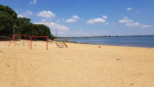 an empty beach with a swing set on it at ITURANCH in Ituzaingó