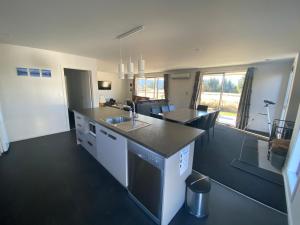 a kitchen with a sink and a counter top at Macaulay House in Lake Tekapo