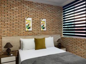 Ένα ή περισσότερα κρεβάτια σε δωμάτιο στο B & A Suites Inn Flats - Apart Flat Stratus +3 φωτογραφίες