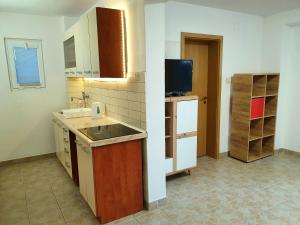 Kuchyň nebo kuchyňský kout v ubytování Apartments Selleng