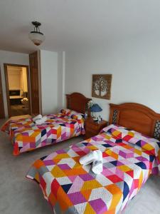 Łóżko lub łóżka w pokoju w obiekcie Pension A Barca