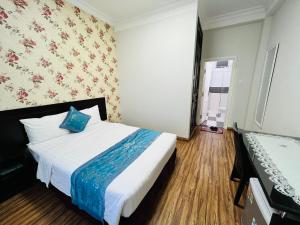 Postel nebo postele na pokoji v ubytování Dalat Eco Hotel