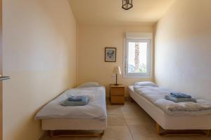 En eller flere senge i et værelse på Villa Fuentes
