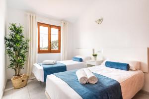 Postel nebo postele na pokoji v ubytování Apartamento Las Palmeras by Mauter Villas + 37 fotografií