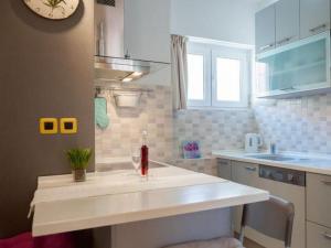 a kitchen with a sink and a counter top at Aldo Apartments Center in Zadar