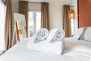 Postel nebo postele na pokoji v ubytování Apartamentos Magna Sevilla