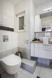 A bathroom at BpR Blue Paradise Apartment with A/C