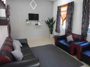TV a/nebo společenská místnost v ubytování Homestay Tok Abah Kuala Besut