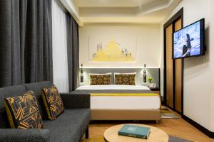Кровать или кровати в номере Citadines City Centre Tbilisi Apart`hotel