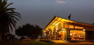 a large building with lights on it at night at Gondwana Kalahari Anib Lodge in Mariental +24 photos