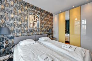 Posteľ alebo postele v izbe v ubytovaní Dom & House - Apartment Old Town Szeroka