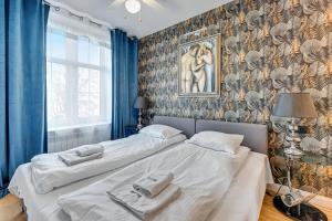 Postel nebo postele na pokoji v ubytování Dom & House - Apartment Old Town Szeroka
