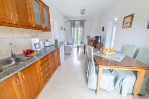 a kitchen with a sink and a counter top at Villa Adonis in Halikounas
