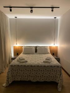 Cama ou camas em um quarto em Verona Parque Hotel