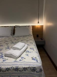 Cama ou camas em um quarto em Verona Parque Hotel