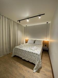 Cama ou camas em um quarto em Verona Parque Hotel