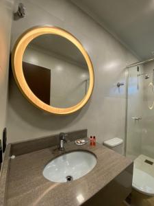 Um banheiro em Verona Parque Hotel