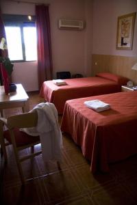 Postel nebo postele na pokoji v ubytování Hotel Las Terrazas