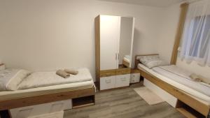 Llit o llits en una habitació de Panorama Apartmenthaus