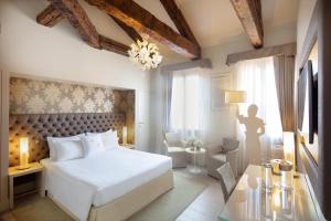 Кровать или кровати в номере Palazzo Barocci