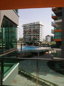 a view of a swimming pool in a building at Siberland olive garden 1+1 residence spa - pool in Alanya