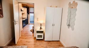 a hallway with a white refrigerator in a room at Holiday Home Cologne with Balkon - near Cologne Fair - temporary living- in Cologne