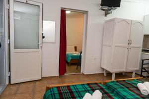 Posteľ alebo postele v izbe v ubytovaní Ilias Studios sevasti